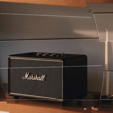 Studio product shot of the Marshall Stanmore III speaker highlighting its classic textured vinyl casing and gold-tone control panel.